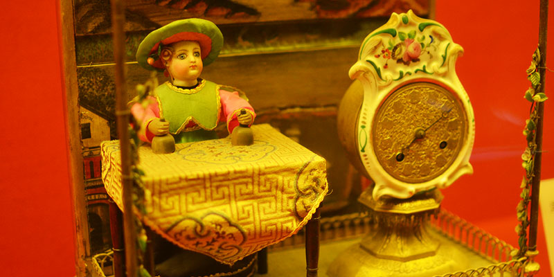 Clock with a western figure performing tricks