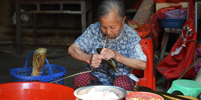 An old lady was making Zongzi