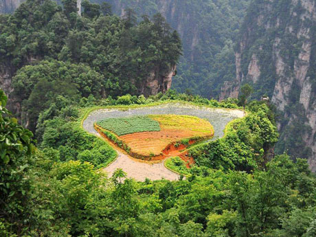 How did the local people change a mountaintop into a farmland?