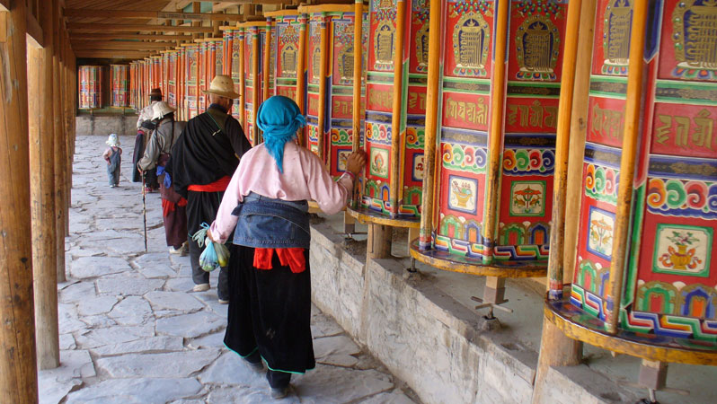 The long corridor of prayer wheels at Labrang Monastery